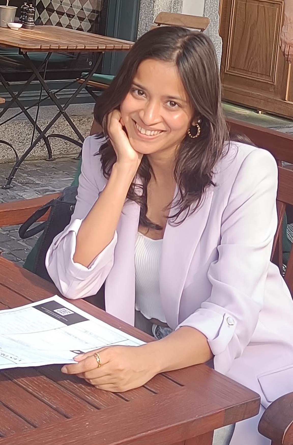 Radhika Agrawal seated at a cafe